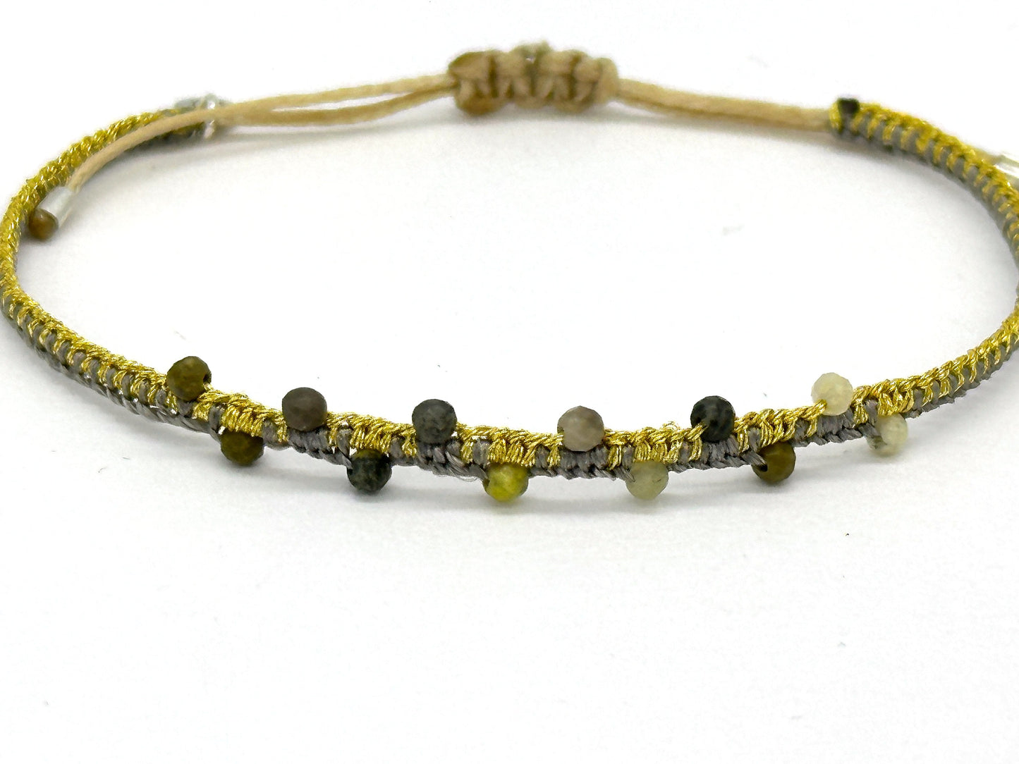 Gewebtes Armband grau / gelbgold mit echten Edelsteinen